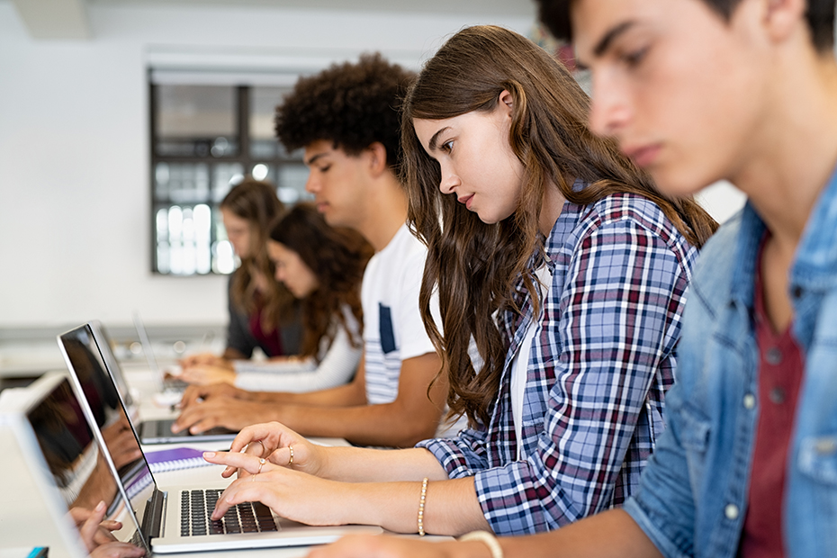 Youth sitting at computers